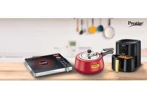 Prestige kitchen appliances including an induction cooktop, pressure cooker, and air fryer displayed as essentials