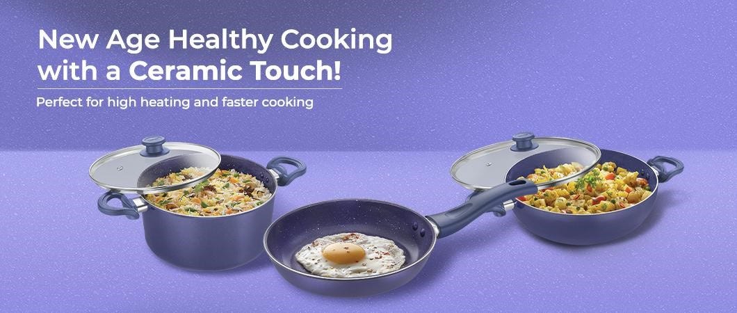 Ceramic Cookware Set Including Two Pots and a Frying Pan With Cooked Dishes