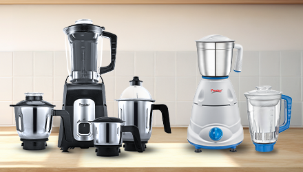 Various Prestige mixer grinders on a kitchen counter